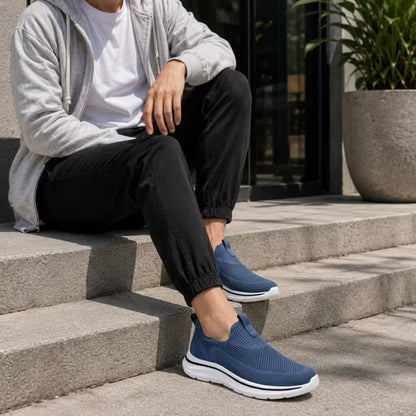 Blue knit slip-on sneakers with cushioned sole and low-profile design