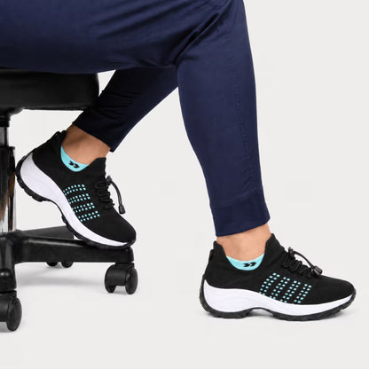 Black and aqua knit lace-up sneaker with white midsole and cushioned tread
