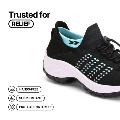 Black lace-up sneaker with aqua collar logo, dotted grid accents, and white midsole