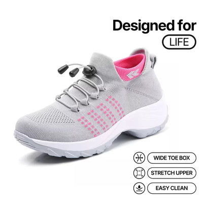 Light gray lace-up sneaker with pink insole collar, wide toe box and textured upper